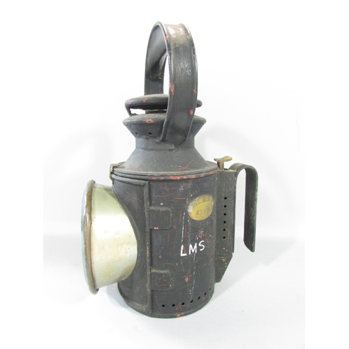 449 - A L.M.S hand lamp, with central rotating red, green, and clear glass lens with the serial number 473... 