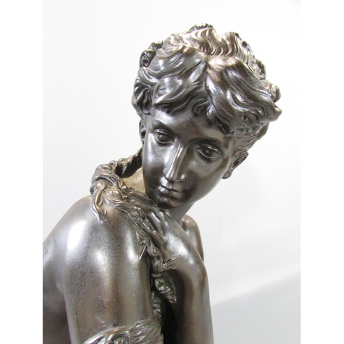 452 - A bronzed resin statuette a shy classical female resting on a stump, after the original signed Morea... 