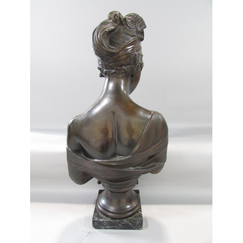 453 - A bronzed bust of a flirtatious woman raised on a marble plinth, bearing a small plaque Mme- Reeamie... 