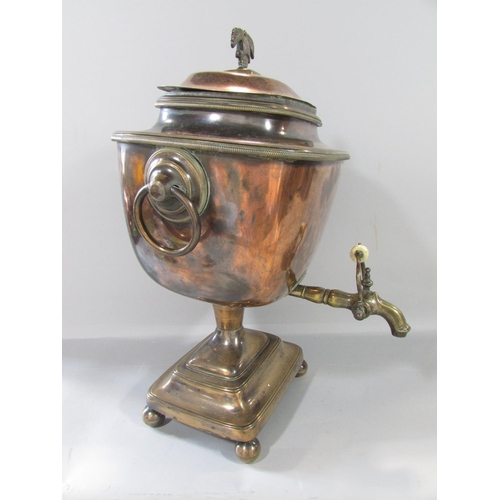 455 - A 19th century copper samovar with brass ring handles together with the original central heating tub... 