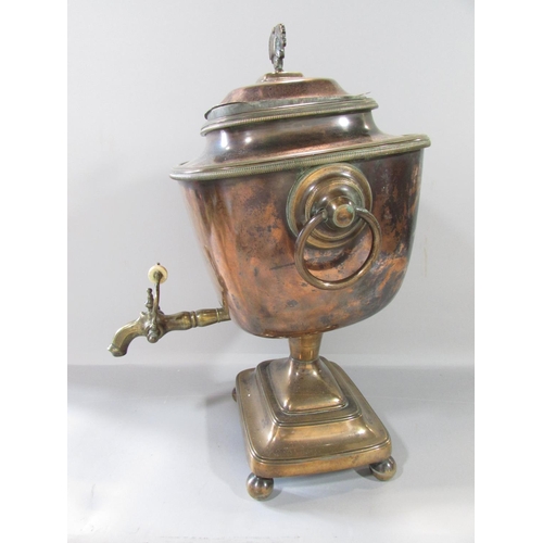 455 - A 19th century copper samovar with brass ring handles together with the original central heating tub... 