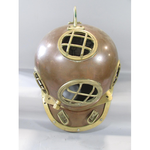 458 - A Vintage copper and brass deep sea diver’s helmet and collar together with a tangle of fairy lights... 