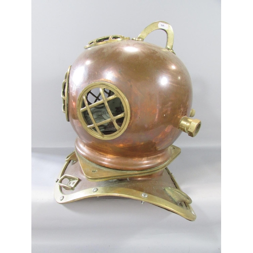 458 - A Vintage copper and brass deep sea diver’s helmet and collar together with a tangle of fairy lights... 