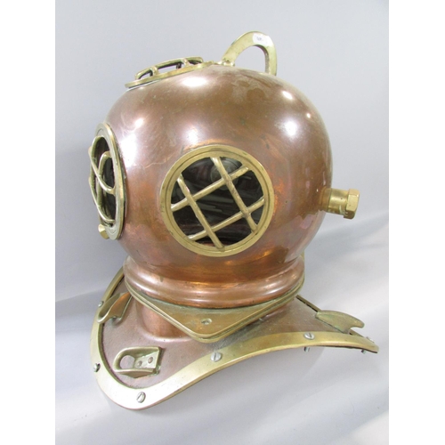 458 - A Vintage copper and brass deep sea diver’s helmet and collar together with a tangle of fairy lights... 