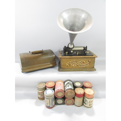 464 - An Edison phonograph in an oak carry case and eleven wax cylinders records