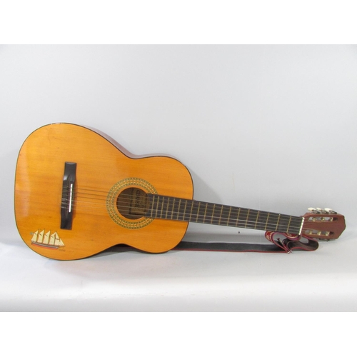 471 - A Tatra Classic Spanish style six string acoustic guitar, made in Czechoslovakia, with a folky strap... 