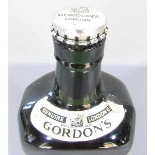 477 - An old bottle 70% Gordon’s Gin still with its original secure metal flip off cap.