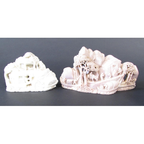 478 - Two Chinese soapstone carvings, on a pinkish colour of people and buildings on a hillside, the other... 