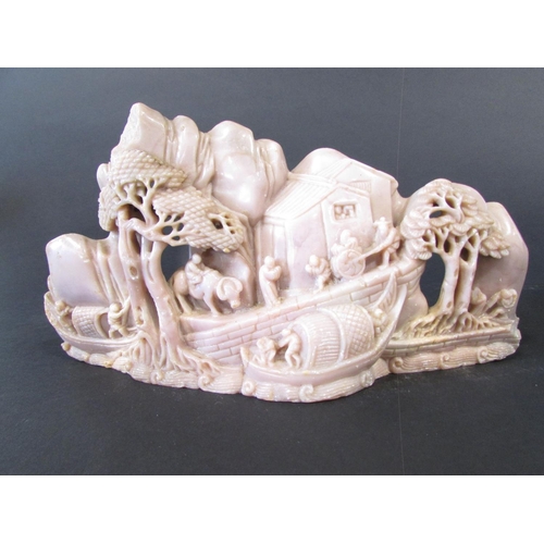 478 - Two Chinese soapstone carvings, on a pinkish colour of people and buildings on a hillside, the other... 