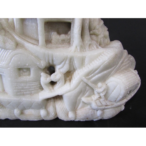 478 - Two Chinese soapstone carvings, on a pinkish colour of people and buildings on a hillside, the other... 