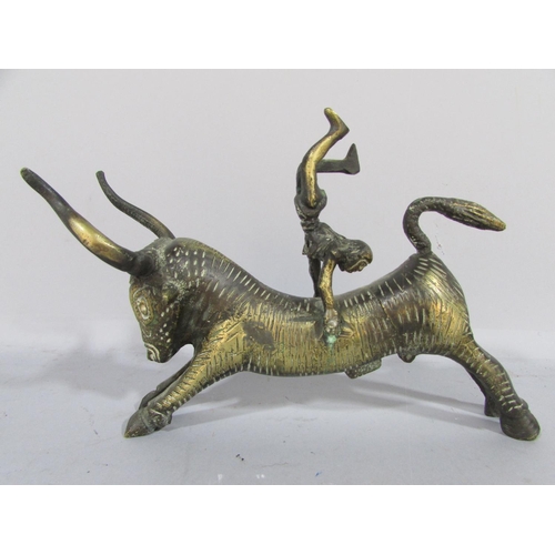 479 - A brass Minoan Bull Leaping Study, a man somersaulting over a bull’s back, 20cm long