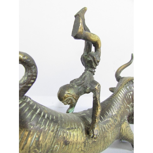 479 - A brass Minoan Bull Leaping Study, a man somersaulting over a bull’s back, 20cm long