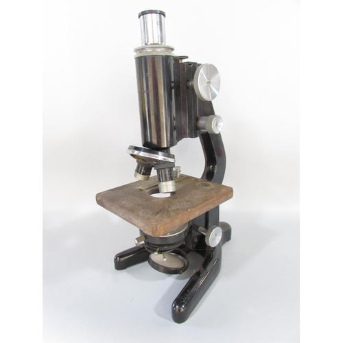 491 - A mid 20th century W Watson & Sons Ltd Service II microscope serial No 109601, with a metal carry ca... 