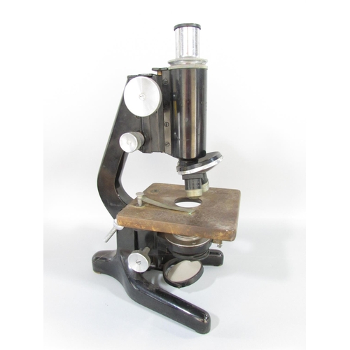 491 - A mid 20th century W Watson & Sons Ltd Service II microscope serial No 109601, with a metal carry ca... 