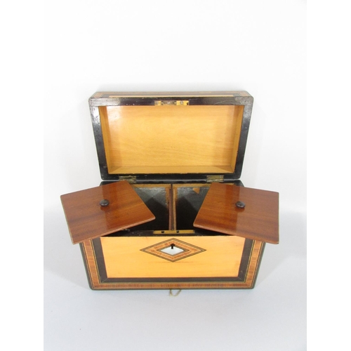 492 - A Victorian satinwood and rosewood inlaid tea caddy with mother of pearl detail and two compartments... 