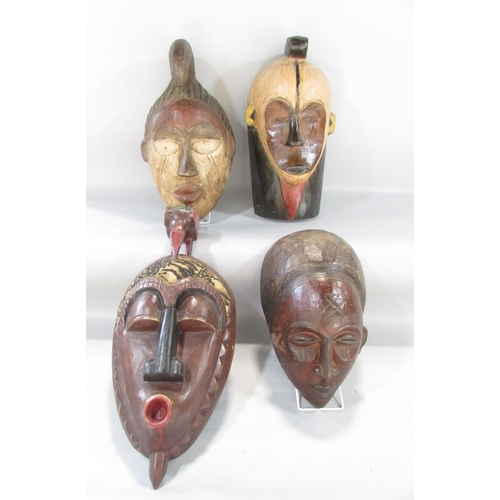 494 - Four old African masks from Cameroon, Ivory Coast and North West Africa.