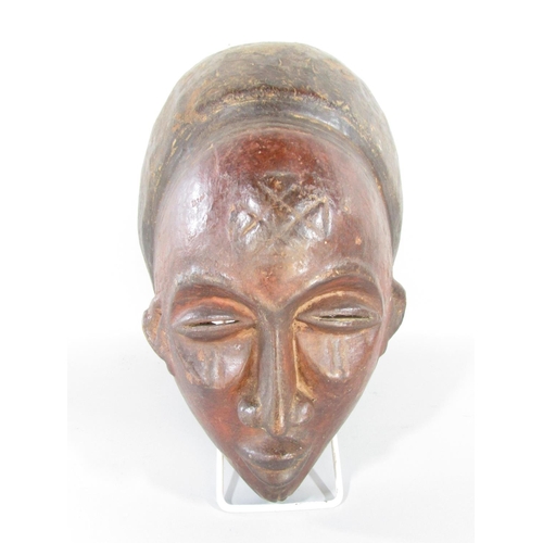 494 - Four old African masks from Cameroon, Ivory Coast and North West Africa.