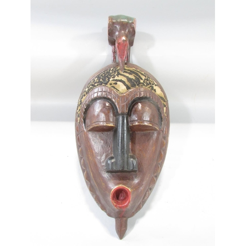 494 - Four old African masks from Cameroon, Ivory Coast and North West Africa.