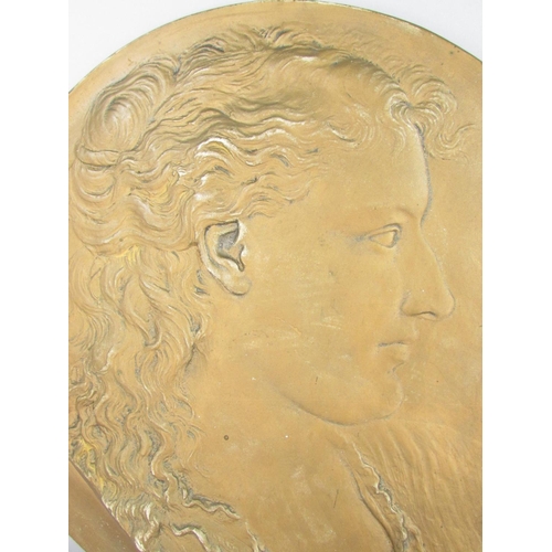 496 - A plaster circular plaque of a profile of a woman in a gold painted finish signed 'George Simonds Ro... 