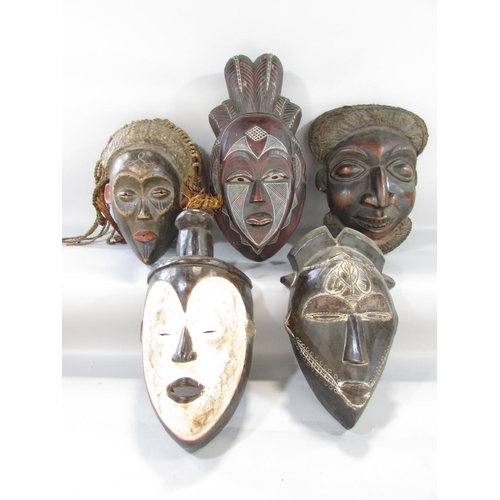 498 - Five African tribal masks from, Cameroon, Ivory Coast and North West Africa.