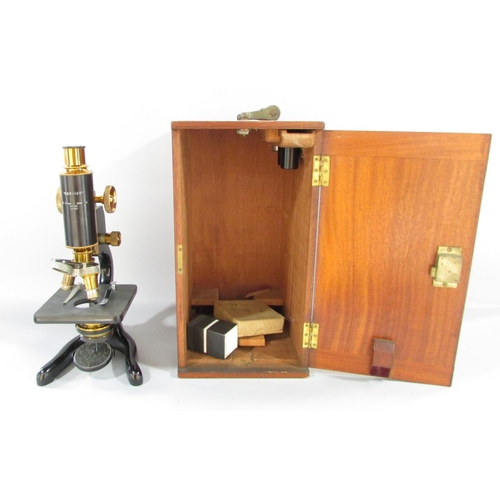 501 - A 1928 W. Watson & Sons Ltd Service microscope serial number 25720, with original mahogany box and k... 