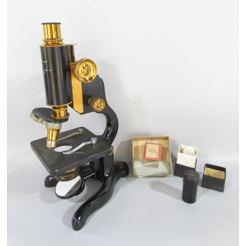 501 - A 1928 W. Watson & Sons Ltd Service microscope serial number 25720, with original mahogany box and k... 