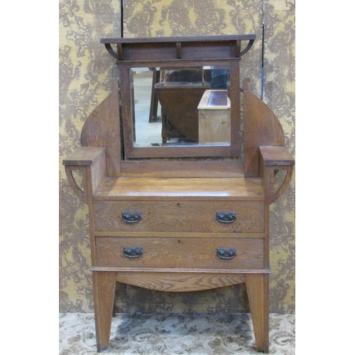 1315 - A late 19th century oak dressing table in the Arts & Crafts style, with integral mirror over two dra... 