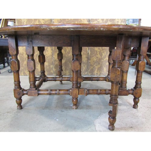 1324 - A large good quality reproduction oak gateleg dining (to seat 12) / wake table, 76 cm high, 205 x 14... 