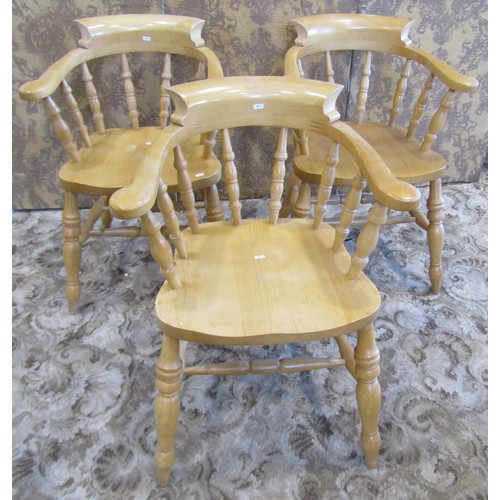 1325 - Two pale pine and ash smoker's bow chairs and an associated rocking chair