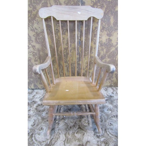 1325 - Two pale pine and ash smoker's bow chairs and an associated rocking chair