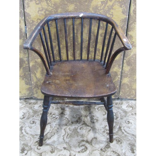 1329 - A small early 19th century Windsor comb back elbow chair