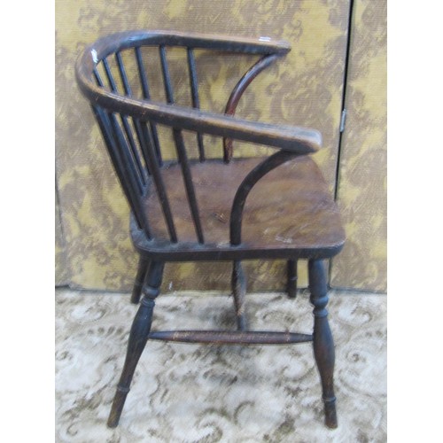 1329 - A small early 19th century Windsor comb back elbow chair