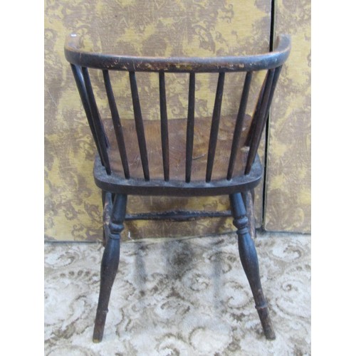 1329 - A small early 19th century Windsor comb back elbow chair