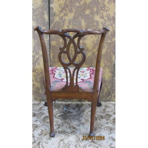 1342 - A George III Irish mahogany dining chair with fixed upholstered seat, carved legs sand paw supports.