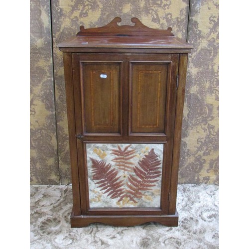 1346 - A small Edwardian mahogany music cabinet, with strung inlaid borders, the hinged panelled door with ... 