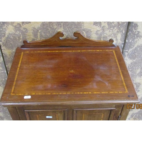 1346 - A small Edwardian mahogany music cabinet, with strung inlaid borders, the hinged panelled door with ... 