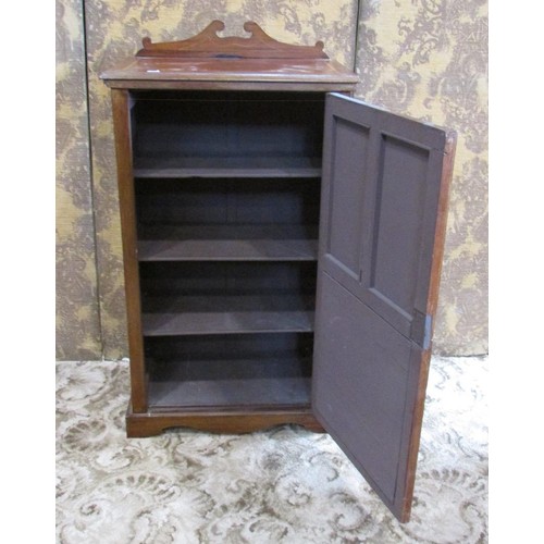 1346 - A small Edwardian mahogany music cabinet, with strung inlaid borders, the hinged panelled door with ... 