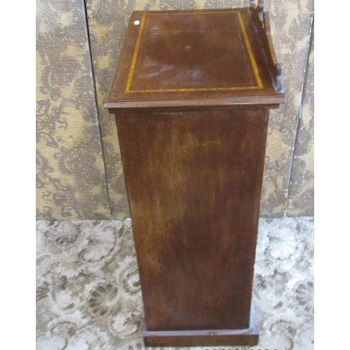 1346 - A small Edwardian mahogany music cabinet, with strung inlaid borders, the hinged panelled door with ... 