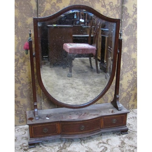 1347 - A large Edwardian toilet mirror with bevelled shield shaped glass over a base fitted with three draw... 