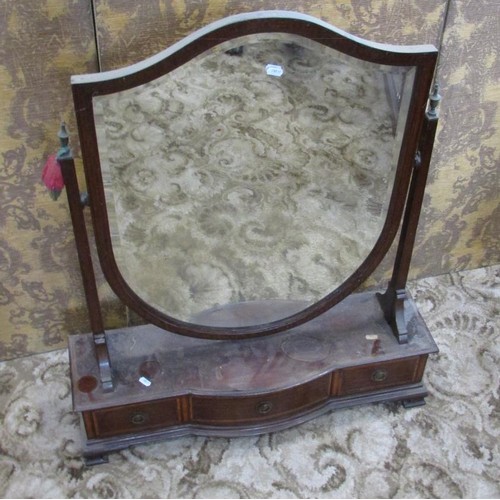 1347 - A large Edwardian toilet mirror with bevelled shield shaped glass over a base fitted with three draw... 