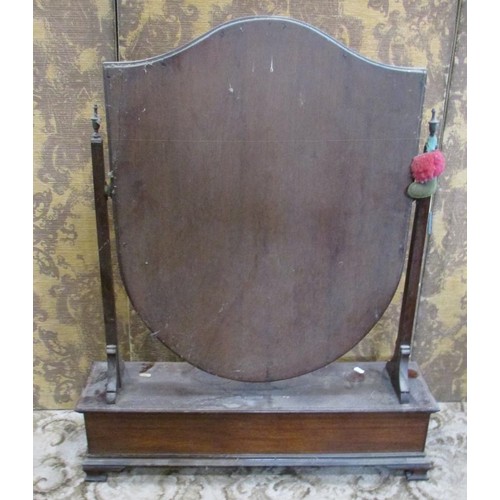 1347 - A large Edwardian toilet mirror with bevelled shield shaped glass over a base fitted with three draw... 