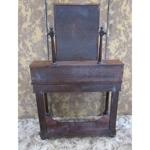 1349 - A Victorian flamed mahogany dressing table, with mirror flanked by tapering column supports over an ... 