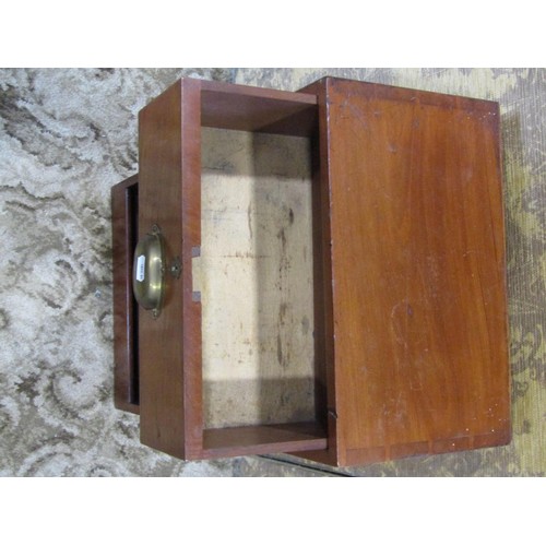 1354 - A small campaign style mahogany bank of three drawers with brass handles, 69cm high, 38 x 23cm.