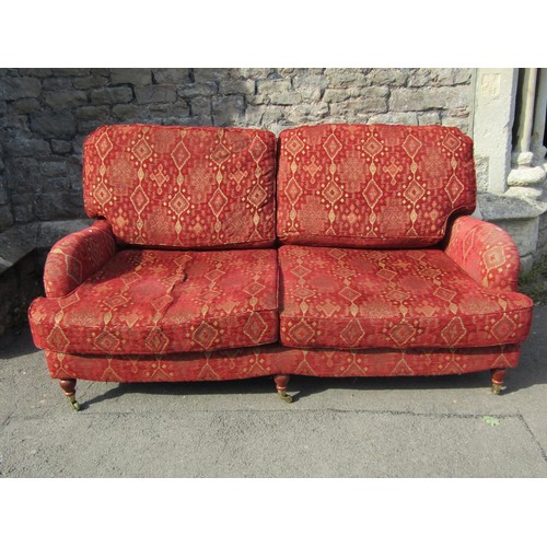 1363 - A good quality Edwardian style red upholstered Kelim style two-seat sofa, raised on turned legs and ... 