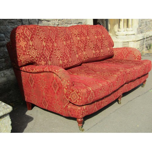 1363 - A good quality Edwardian style red upholstered Kelim style two-seat sofa, raised on turned legs and ... 