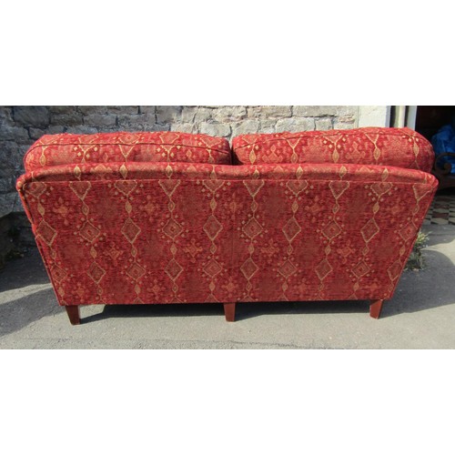 1363 - A good quality Edwardian style red upholstered Kelim style two-seat sofa, raised on turned legs and ... 