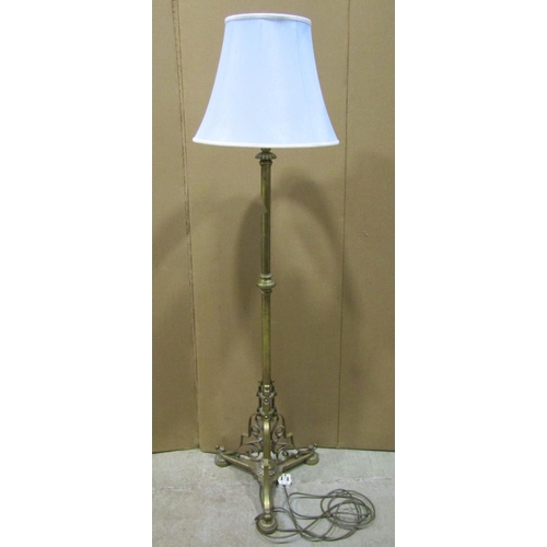 1374 - An Edwardian brass floor-standing standard lamp with scrolled mounts, 125cm high