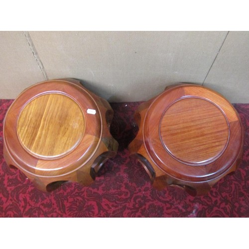 1383 - A pair of Chinese hardwood jardiniere stands, each 35cm high, 29cm diameter.