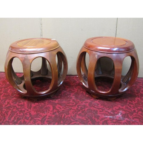 1383 - A pair of Chinese hardwood jardiniere stands, each 35cm high, 29cm diameter.