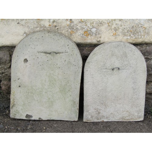 1385 - Two similar associated weathered simulated stone panels of arched form, each decorated with a moulde... 